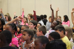 Kids eager to ask questions about their Bluegrass instruments and performing